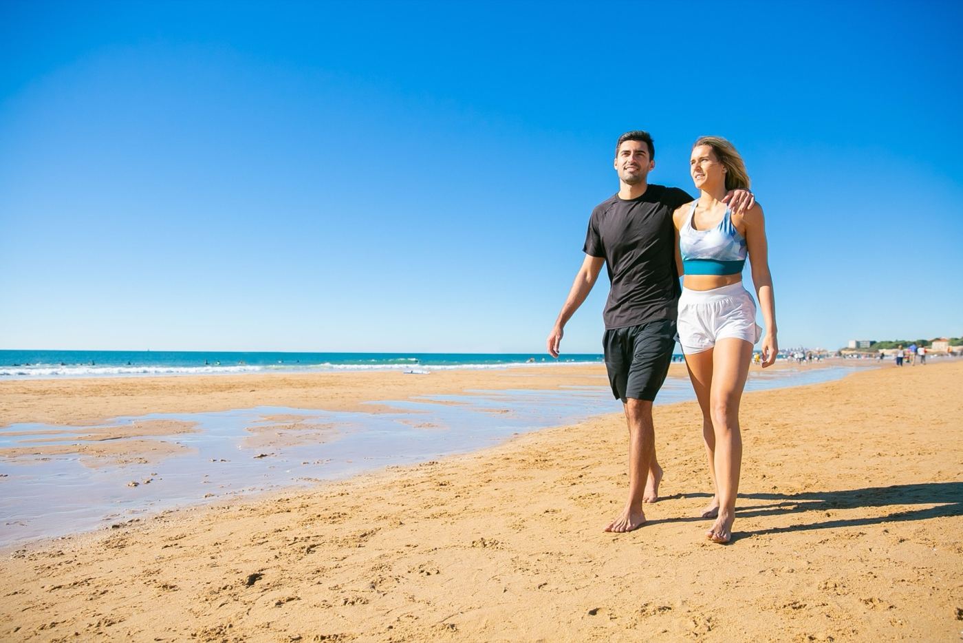 Couple walking together on a bright day out